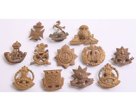 Selection of Brass Regimental Lapel Badges, consisting of The Essex Regiment, Finsbury Rifles (pin fitting), Army Ordnance Co