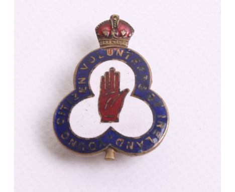 Young Citizen Volunteers of Ireland Badge in gilt and enamel. Centre of the badge has the red hand of Ulster. Reverse has lap