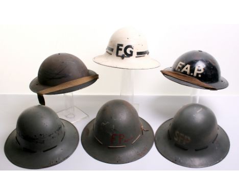 Selection of British WW2 Steel Helmets consisting of black painted example complete with liner which is dated 1943, 1941 date