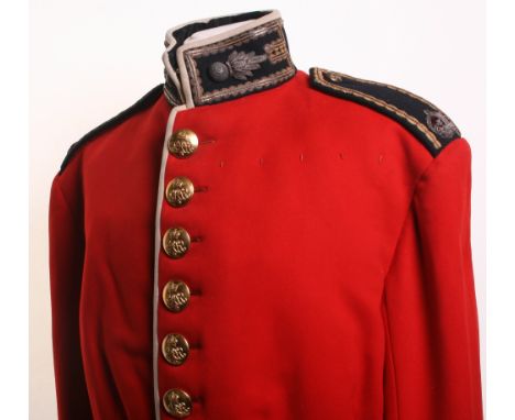 Post 1902 Grenadier Guards Majors Dress Tunic of fine red cloth with blue facings. Stand up collar decorated with bullion wir
