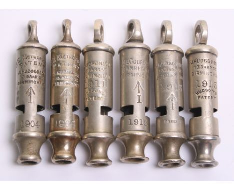 Six Pre WW1 Military Issue Whistles, all being Metropolitan pattern examples. Five are made by J Hudson & Co and the other is