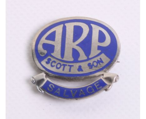 WW2 Home Front ARP Scott & Son Lapel Badge of chrome with blue enamel. Bottom of the badge has a scroll with SALVAGE. Reverse