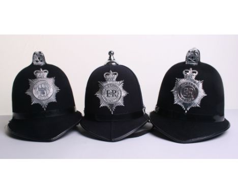 Three Obsolete Police Helmets, Queens Crown Dorset Police Cox Comb helmet, Queens Crown Devon & Cornwall Constabulary Ball To