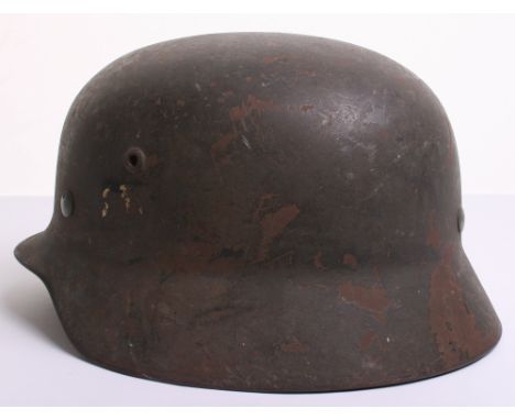 Kriegsmarine M-35 Steel Combat Helmet complete with much of its original field grey combat paint finish. Remains of the origi