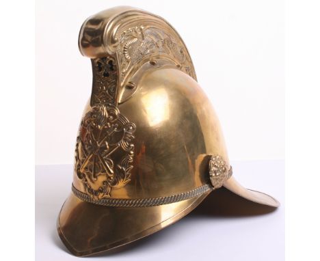 Brass Merryweather Fire Helmet with standard crossed axes and torch helmet plate to the centre. Brass comb top with dragons. 