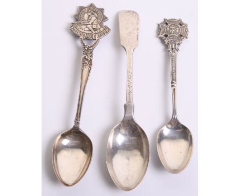 Three Tea Spoons, one being a hallmarked silver (Sheffield 1927) prize awarded to CSM J Coutanche 1928 The Royal Guernsey Lig