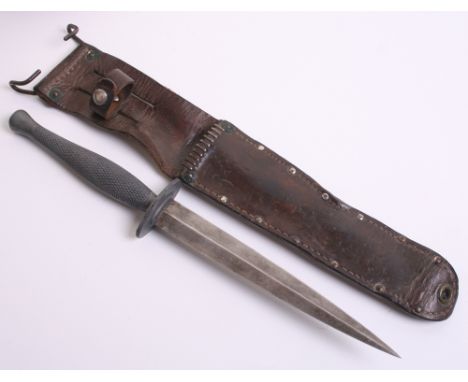 USMC Raiders Fighting Knife being one piece grip with FS style blade. Complete with its original leather scabbard with hook f