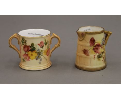 A Royal Worcester jug and a Royal Worcester two handled cup. The former 6 cm high.