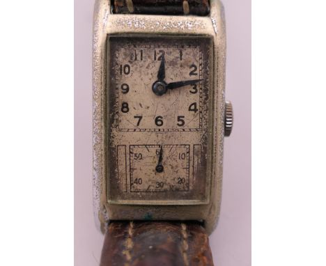 A vintage Art Deco wristwatch. 2 cm wide.