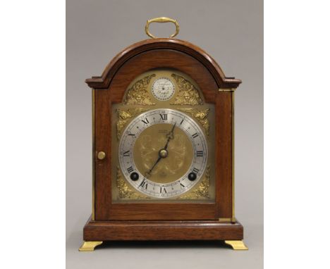 A mahogany mantle clock. 26 cm high.
