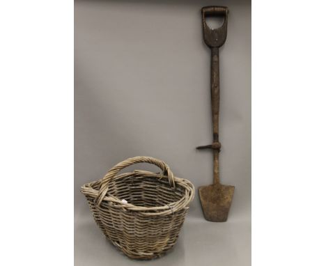 A vintage peat spade and a potato basket. The former 93.5 cm high.