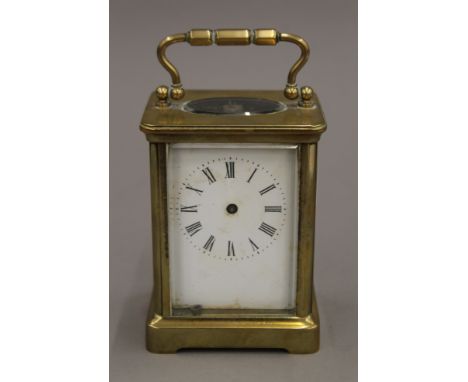 A brass cased carriage clock. 13 cm high.