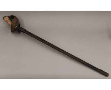 A Cavalry sword in a leather scabbard. 111 cm long.