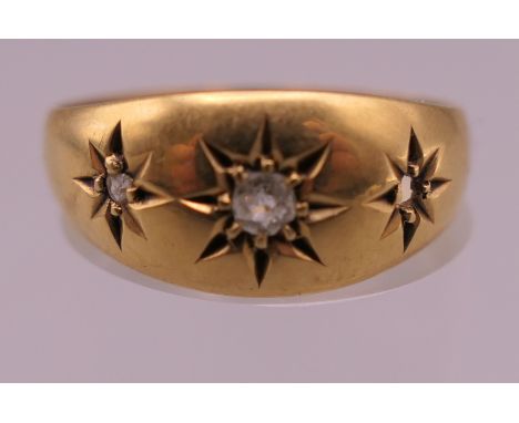 An Edwardian 18 ct gold diamond gypsy ring. Ring size P. 2.8 grammes total weight.