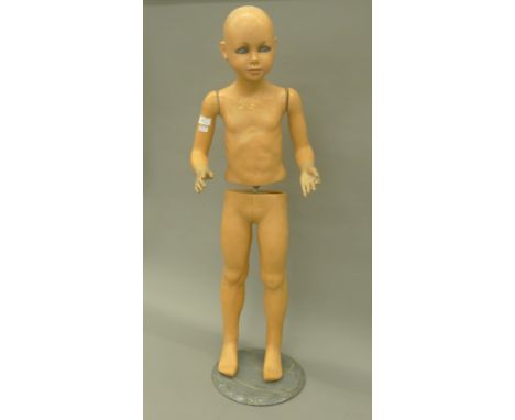A vintage glass eye child mannequin.  105 cm high. 