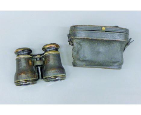 A pair of field glasses with inset compass, case. 13.5 cm wide overall.