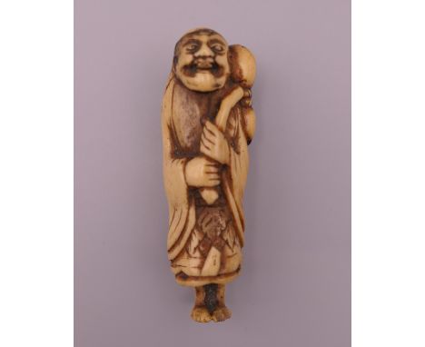 A 19th century carved bone netsuke formed as Sennin carrying a gourd.  7 cm high. 