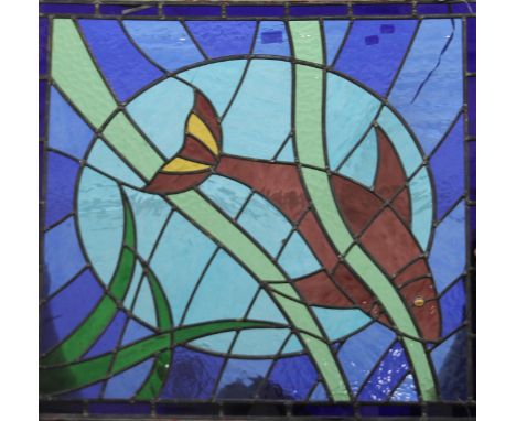 A stained leaded glass panel centred with a fish. 80 x 74.5 cm.