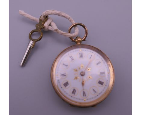A 14 K gold ladies fob watch. 3.5 cm diameter. 29.7 grammes total weight.