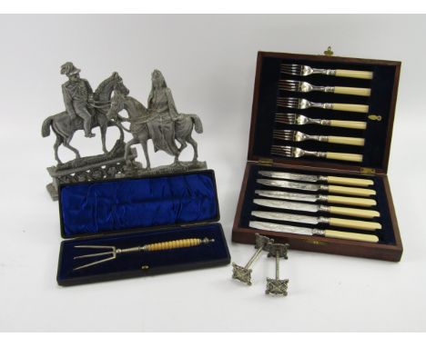 A cased set of silver plated dessert knives and forks, together with a Trident pickle fork, a pair of knife stands and a pair