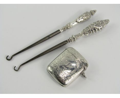 A silver curvilinear vesta case, with foliate engraving, reserve monogram and date engraved, hallmarked Birmingham and two Vi