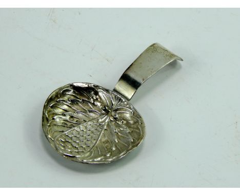 A George III silver caddy spoon, the bowl of artichoke chased form, Birmingham 1810, 0.265t oz.