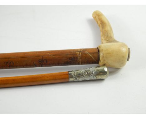 An Imperial gallon measuring walking stick, with horn handle by Loftus, 146 Oxford Street, London, 91cm long, together with a