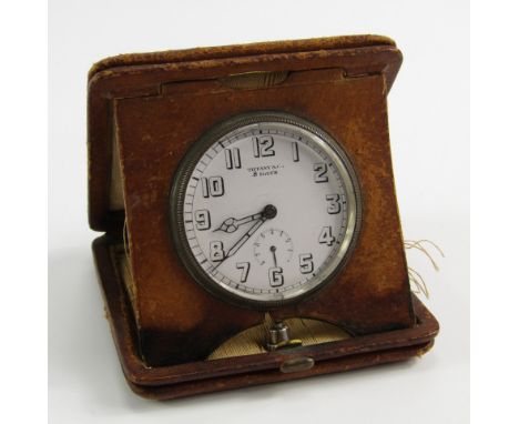 A Tiffany & Co travel clock, white enamel dial bearing Arabic numerals, subsidiary eight day dial, Longines eight day movemen