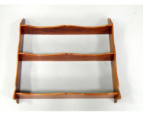 An Edwardian mahogany three shelf wall rack or bookstand, top shelf height 46cm