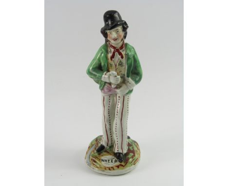 A Staffordshire pottery double sided figure, modelled as gin and water, late 19thC, raised on a naturalistic titled base, 22.