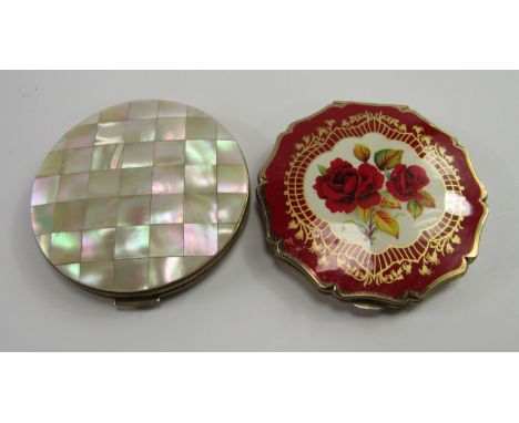 Two Stratton compacts, one with mother of pearl parquet decoration, the other enamel decorated with roses against a red groun