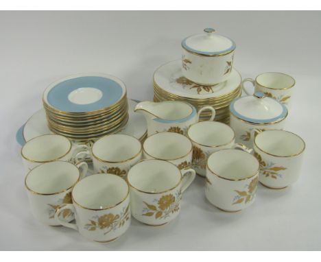 An Aysnley porcelain part tea service, decorated in the Golden Grace pattern, comprising a pair of bread plates, cream jug, a