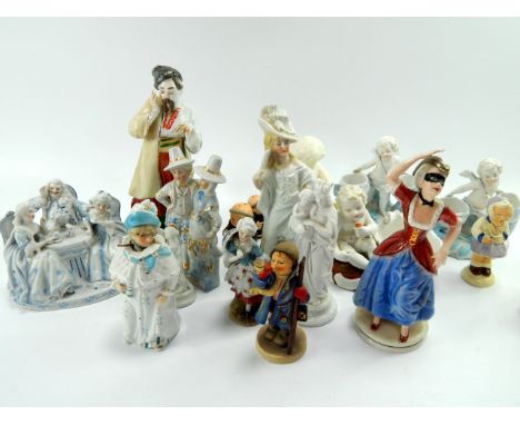 19thC and later porcelain and pottery figures, including a Russian peasant figure, a Continental porcelain conversation group