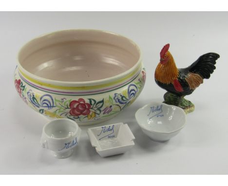 A Poole Pottery bowl, traditional painted with flowers, printed mark, 22.5cm diameter, together with a Beswick cockerel and a