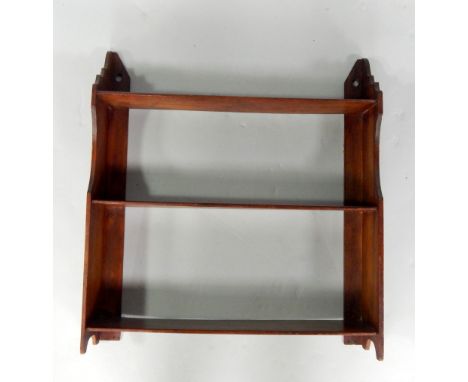 An Edwardian mahogany three shelf wall rack or bookstand, top shelf height 46cm