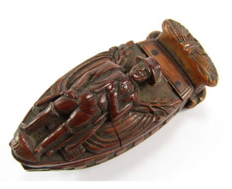 A Regency coquilla nut snuff box, carved with Napoleon being conveyed upon HMS Northumberland to captivity in St Helena
