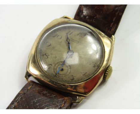 A gentleman's 9ct gold cased wristwatch, H L Brown, 8.5cm, engine turned circular silvered dial, subsidiary seconds dial, on 