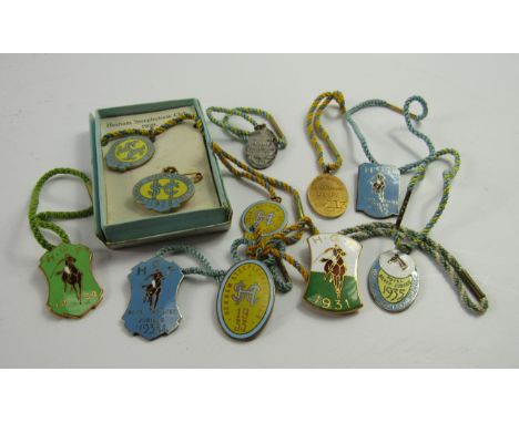 Hexham Steeplechase Club and HGP Polo enamel badges, 1928-35, gentleman and lady, with silk tassels by Reids, Newcastle on Ty
