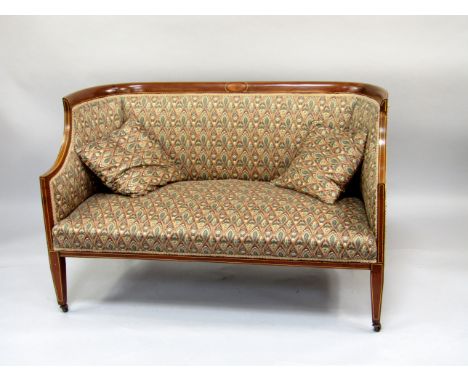 A late Victorian mahogany boudoir sofa, with string inlaid decoration and floral stylised upholstery, 125cm wide.