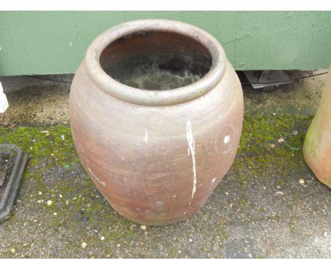 A large stoneware garden planter.