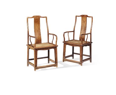 A FINE PAIR OF HUANGHUALI YOKEBACK ARMCHAIRS, NANGUANMAOYI17th centuryEach with a curved crest rail supported on curved rear 