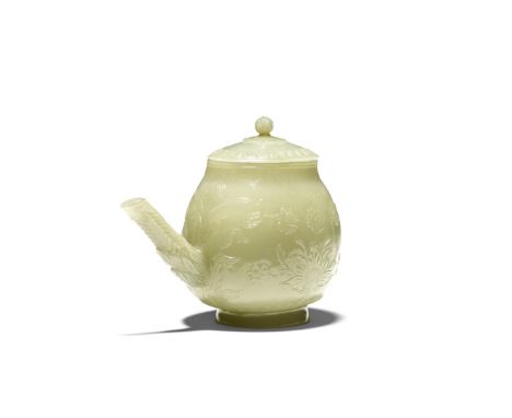 A Mughal pale green jade ewer and coverIndia, 18th centuryThe pear-shaped body rising from a short foot, carved in low relief