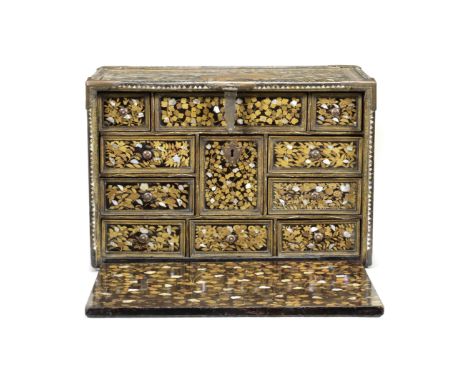A RARE GILT-COPPER-MOUNTED SHELL-INLAID NANBAN LACQUER CABINETMomoyama Period, late 16th/early 17th centuryEmbellished predom