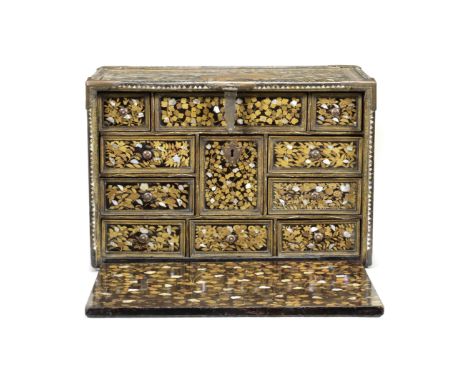 A RARE GILT-COPPER-MOUNTED SHELL-INLAID NANBAN LACQUER CABINETMomoyama Period, late 16th/early 17th centuryEmbellished predom