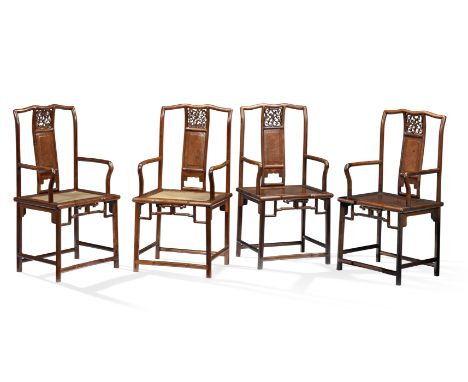 A RARE SET OF FOUR HUANGHUALI AND BURLWOOD CONTINUOUS YOKEBACK ARMCHAIRS, NANGUANMAOYI18th centuryEach with a cylindrical cre