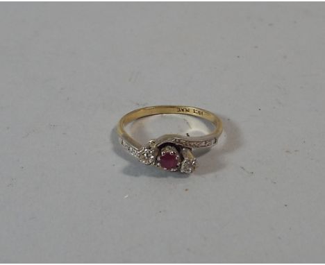 An 18 Carat Gold and Platinum Dress Ring Set with Ruby and Two Diamond Chips. 3.0 g. 