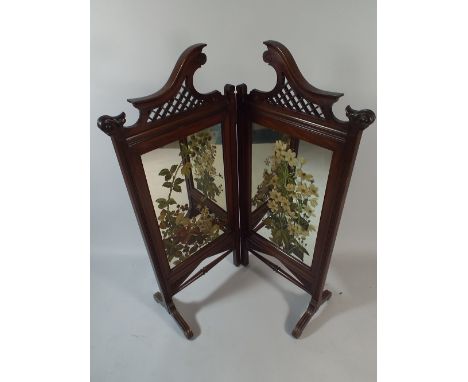 A Victorian Mahogany Framed Folding Firescreen with Painted Mirrored Panels, Pierced Swan Neck Cornice and Scrolled End Piece
