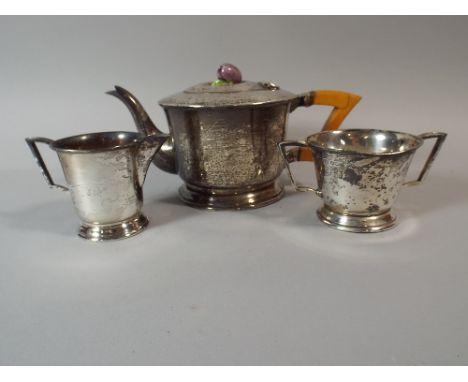 A Silver Three Piece Tea Service, The Teapot with Ceramic Handle in The Form of Fruit. Sheffield 1938.