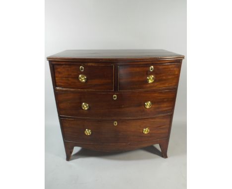 A Mid 19th Century Crossbanded and String Inlaid Mahogany Bow Fronted Chest of Two Short Drawers and Two Long Drawers. Circul