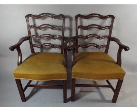 A Set of Four Mahogany Framed Dining Carved Chairs with Pierced Ladder Backs.
